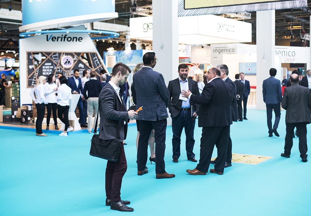 Businessmen standing around the conference hall of Money20/20 Europe 2017